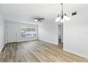 The light filled living room boasts updated flooring and neutral paint tones at 2286 Norwegian Dr # 8, Clearwater, FL 33763
