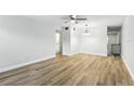Bright living room featuring ceiling fan and sleek, wood-look flooring at 2286 Norwegian Dr # 8, Clearwater, FL 33763