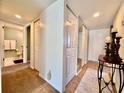 Inviting condo entryway featuring tiled floors and access to the bathroom at 2700 Cove Cay Dr # 2B, Clearwater, FL 33760
