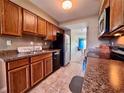 The condo kitchen features sleek appliances and ample counter space at 2700 Cove Cay Dr # 2B, Clearwater, FL 33760