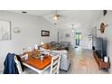 Open-concept living and dining area with tile flooring and neutral paint at 2810 9Th St, Englewood, FL 34224