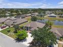 An aerial view shows the property's backyard, pond, and surrounding neighborhood at 4535 29Th Avenue E Cir, Palmetto, FL 34221