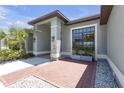 Beautiful home showcasing detailed architectural design, landscaping, and a welcoming entrance at 4535 29Th Avenue E Cir, Palmetto, FL 34221