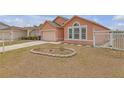 Well-maintained yard and manicured landscape enhancing the curb appeal of the property, with a glimpse of the house at 4617 Horseshoe Pick Ln, Valrico, FL 33594