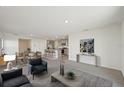 Spacious living room with an open floor plan connected to the kitchen and dining area at 7530 Broad Pointe Dr, Zephyrhills, FL 33540