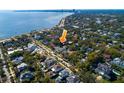 Scenic aerial view of the neighborhood near the coast with lush greenery and city views at 827 S Delaware Ave, Tampa, FL 33606