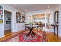 Elegant living room featuring hardwood floors, built-in bookshelves, and an open layout at 827 S Delaware Ave, Tampa, FL 33606