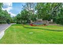 Professionally landscaped community entrance to Hunter's Green with stone monument sign at 9315 Knightsbridge Ct, Tampa, FL 33647