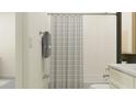 Bathroom boasting a subway tile shower, modern fixtures, and an elegant towel rack at 11845 Sparkling Topaz Cv, Parrish, FL 34219