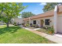 Charming townhome with a well-manicured lawn and meticulously maintained landscaping at 1278 Mission Cir # 45B, Clearwater, FL 33759