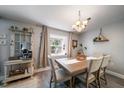 Dining area with chandelier and stylish decor at 1715 Belleair Forest Dr # C, Belleair, FL 33756