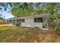 A lovely exterior of a one-story house with dark trim around windows and doors at 2026 Cocoanut Ave, Sarasota, FL 34234