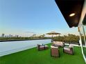Relaxing rooftop patio with outdoor seating, artificial turf, and skyline views at 2104 4Th S St, St Petersburg, FL 33705