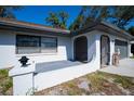 Close up of the front porch featuring an entry to the house at 2167 Corfell St, Port Charlotte, FL 33948