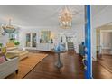 Bright and stylish living room with hardwood floors and elegant decor, viewed from entryway at 2523 W Sunset Dr, Tampa, FL 33629