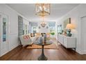 Elegant living room with a fireplace, hardwood floors, and a cozy seating arrangement at 2523 W Sunset Dr, Tampa, FL 33629