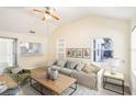 Comfortable living room with vaulted ceilings, filled with natural light and neutral decor at 2604 Oakdale St, Seffner, FL 33584