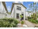 Inviting townhome with a well-maintained front yard, black front door, and a pleasant curb appeal at 310 S Delaware Ave # F, Tampa, FL 33606