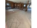 Spacious living room featuring exposed beams and cinderblock walls, ready to be renovated at 4218 Carson Ne St, St Petersburg, FL 33703