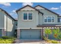 Exterior showcasing the facade with a two-car garage and beautiful brick paver driveway at 4828 San Martino Dr, Wesley Chapel, FL 33543