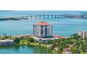 Stunning aerial view of the condo building, showing surrounding waterways, landscaping, and bridge at 6287 Bahia Del Mar Cir # 801, St Petersburg, FL 33715