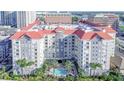 Upscale condo complex featuring a central pool, palm trees, and views of the city skyline, offering a luxurious lifestyle at 700 S Harbour Island Blvd # 342, Tampa, FL 33602
