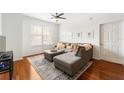 Inviting living room with hardwood floors, a plush sectional sofa, and plenty of natural light from the large window at 700 S Harbour Island Blvd # 342, Tampa, FL 33602