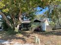 Charming single-story home with a well-manicured front yard and mature trees at 7421 Mulligan Ct, Port Richey, FL 34668