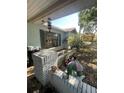 Welcoming home exterior with a quaint front porch and lush landscaping at 7421 Mulligan Ct, Port Richey, FL 34668
