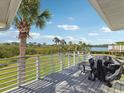 Enjoy picturesque lake views from this spacious back deck, complete with grill at 1015 S Pointe Alexis Dr, Tarpon Springs, FL 34689