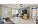 Cozy living room with tile floors, neutral paint, and modern furniture at 12790 118Th St, Seminole, FL 33778