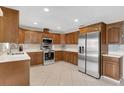 Spacious kitchen with stainless steel appliances, wood cabinets, and white countertops at 1403 Garden Ave, Tarpon Springs, FL 34689