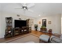 Bright living room showcasing a ceiling fan, a spacious layout, and contemporary decor at 2021 Shangrila Dr # 14, Clearwater, FL 33763
