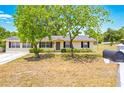 Inviting single-story home with manicured landscaping and classic curb appeal at 27343 Warner Ave, Brooksville, FL 34602