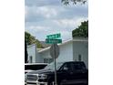 Street sign showing the intersection of W North B ST and N Bradford AV with a view of neighborhood homes at 3210 W North B St, Tampa, FL 33609