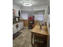 Cozy eat-in kitchen featuring tile flooring and a full suite of appliances at 4851 W Gandy Blvd # B3L12, Tampa, FL 33611