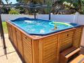 Inviting hot tub with bubbling water, poolside accessories and pergola, perfect for relaxing and entertaining at 5324 3Rd N Ave, St Petersburg, FL 33710