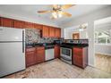 Functional kitchen with stainless steel appliances, backsplash, and tile flooring at 5324 3Rd N Ave, St Petersburg, FL 33710