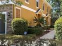 Side view of a multi-story home showcasing the landscape and exterior at 5527 Kinglethill Dr, Lithia, FL 33547