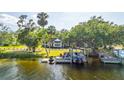 Beautiful waterfront home with boat dock and lift, perfect for enjoying lake access at 5610 N River Shore Dr, Tampa, FL 33603