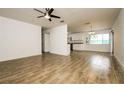 Bright living room featuring neutral paint, ceiling fan, and tile flooring at 5670 Postma St, North Port, FL 34287