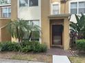 Inviting two-story townhome featuring manicured landscaping and a welcoming entrance at 6405 Osprey Lake Cir, Riverview, FL 33578
