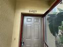 Close-up of the front door showing house number and secure entry at 6405 Osprey Lake Cir, Riverview, FL 33578
