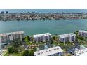 Condo buildings offering waterfront views, lush landscaping, and a peaceful community setting at 8000 Sailboat Key S Blvd # 202, St Pete Beach, FL 33707