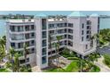 This attractive condo boasts balconies and lush landscaping, set in a tropical paradise at 8000 Sailboat Key S Blvd # 202, St Pete Beach, FL 33707