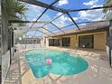 Inviting in-ground pool surrounded by a screened enclosure and patio area for outdoor enjoyment at 8124 Golf Club Ct, Hudson, FL 34667