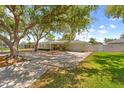 Charming single-story home with a well-manicured lawn, mature tree and an attached garage and fenced in yard at 12453 138Th N St, Largo, FL 33774