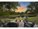 Enjoy the firepit and lakeside views at 14019 Nighthawk Ter, Lakewood Ranch, FL 34202