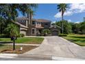 Beautiful curb appeal, with mature trees surrounding the property at 16637 Ashton Green Dr, Lutz, FL 33558