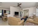 Open concept living area featuring modern furnishings, a ceiling fan, and an open transition to the kitchen at 2153 Pocahontas Dr, Largo, FL 33774
